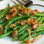 Here’s a tasty way to serve up garden fresh green beans this summer. Smokey bacon and tangy mustard give these tender-crisp green beans memorable flavor. 